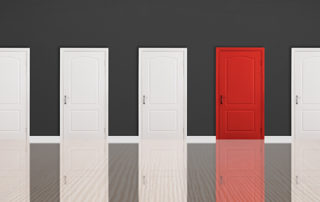 Line of doors with one red